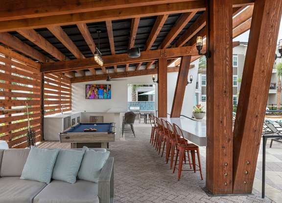Apartments In Riverview, FL for Rent – Sole at Brandon – Poolside Grill, Pool Table and Lounge Area