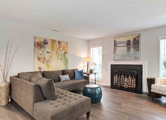 Glen Lake Apartments in Atlanta, GA 30328 photo of a living room with hardwood floors and a fireplace