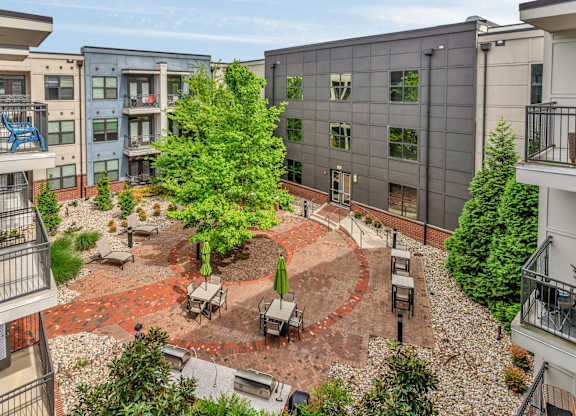 Apartments In Nashville for Rent - Octave Apartments - courtyard area with tables and chairs for relaxing