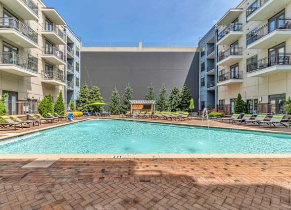 Pet-Friendly Apartments in Nashville, TN- Octave Apartments- resort style swimming pool with sundeck and lounge chairs