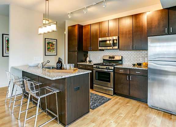 a kitchen with stainless steel appliances and a counter top