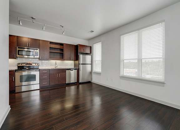 12 South Apartments - Nashville TN - kitchen with dark wood cabinets and stainless steel appliances