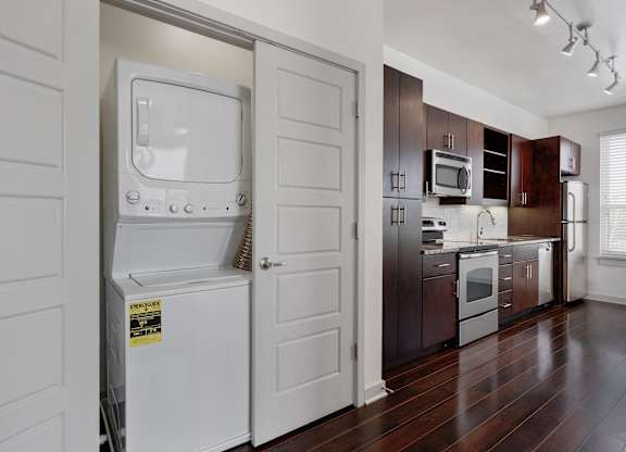 12 South Apartments - Nashville TN - kitchen with dark wood cabinets and stainless steel appliances