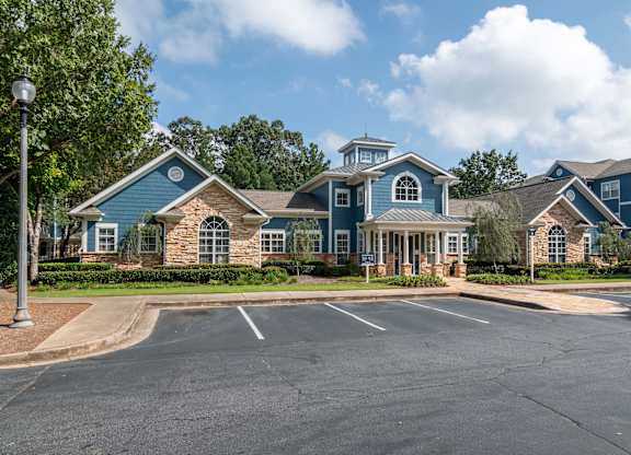 Apartments In Woodstock for Rent – Lea Woodstock – exterior of leasing office and view of parking lot