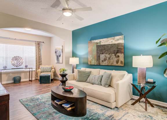 Woodstock, GA Apartments – Lea Woodstock – spacious living room with hardwood floors, ceiling fan and view of sun room