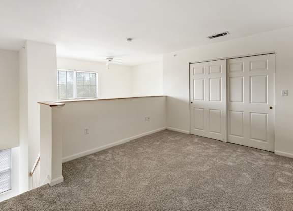 Orchards Apartments Marlborough ma apartment loft style apartments photo of loft bedroom workspace home office area with carpet and white walls and storage closet