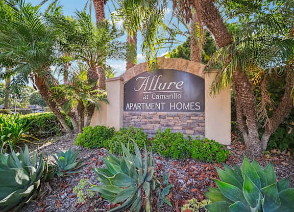 the sign at the entrance to allure apartments
