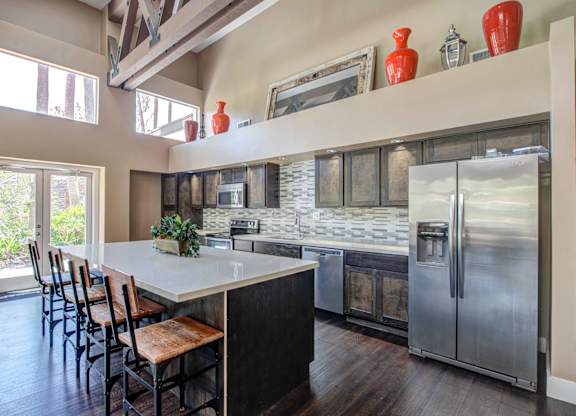 Apartments for Rent in San Clemente, CA- Rancho Del Mar - Resident Lounge & Kitchen featuring Stainless-Steel Appliances and Island with seating