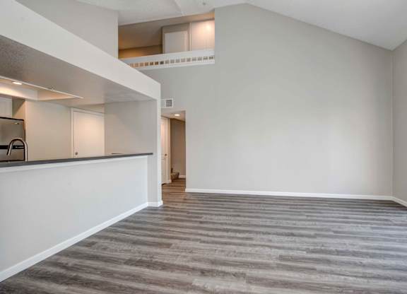 One Bedroom apartments in San Clemente CA- Rancho Del Mar - Spacious Living Room featuring Hardwood-Inspired Flooring & lots of natural light