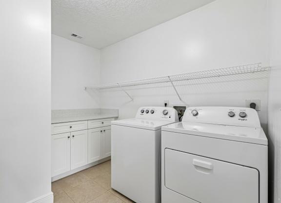 A laundry room with a washer and dryer.