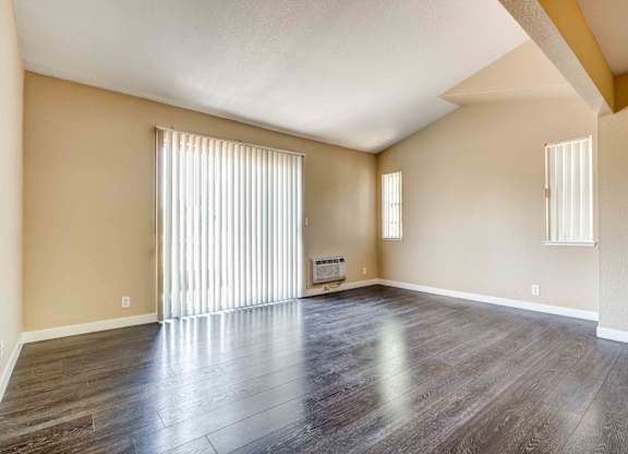 Studio Apartments in Silicon Valley CA - Terra House - An interior shot of the living room featuring hardwood-inspired flooring and lofted ceilings
