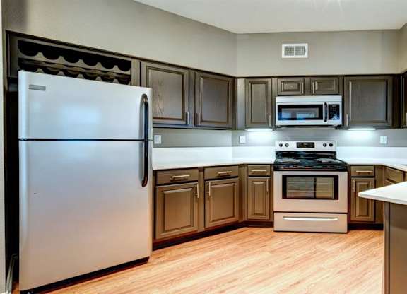Regency at dell ranch large spacious kitchen brown kitchen cabinets