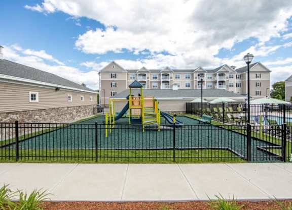 a playground is shown in front of a building