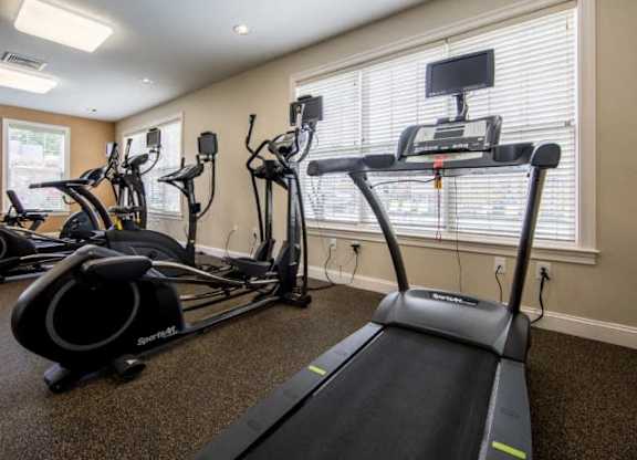 a room filled with lots of exercise equipment