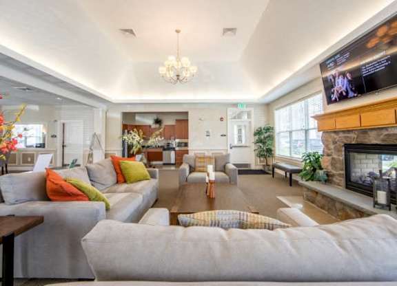 a living room filled with furniture and a fire place