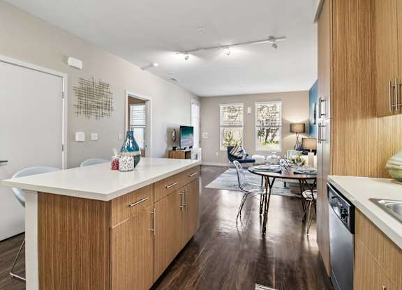 A kitchen with wooden cabinets and a white countertop.