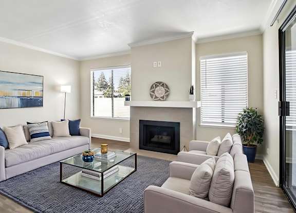 A living room with a fireplace and a couch.