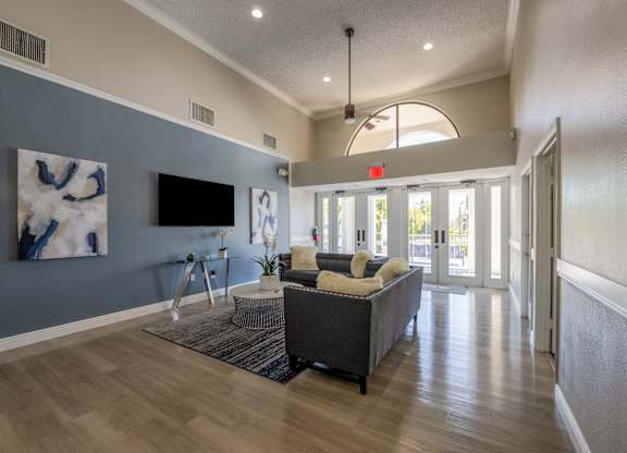 Coconut Creek Apartments – Waterview at Coconut Creek – clubhouse with sitting area and tv