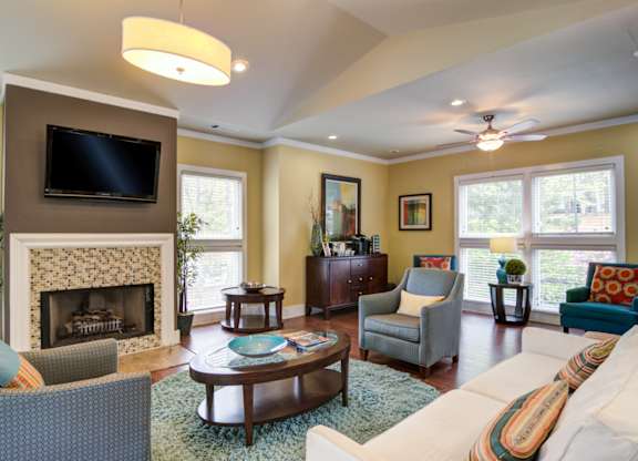 Pet-Friendly Apartments in Marietta– Wood Pointe Apartments – Our Clubhouse with a fireplace and a television.