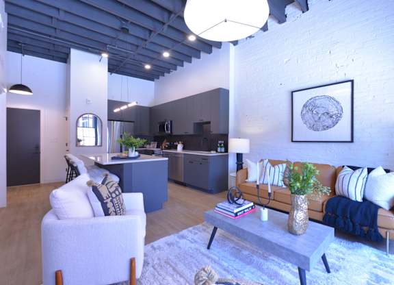 A living room with a couch, chair, and coffee table.