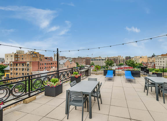 Rooftop deck with tables and seating at 1633 Q, Washington, DC, 20009