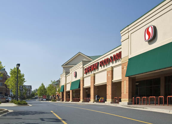 a shopping center with a sign on the front of it at The Residences at King Farm, Rockville, Maryland