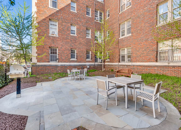 Courtyard with grills  at The August in Washington, DC 20037