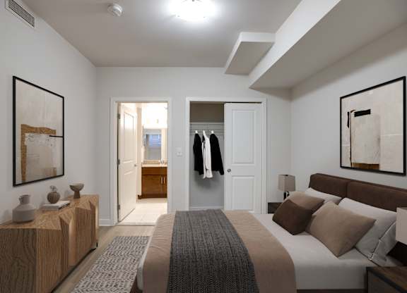 A bedroom with a large bed and a wooden dresser.