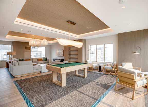 Newly renovated rooftop resident lounge with pool table at Lenox Club Apartments in National Landing, VA 22202
