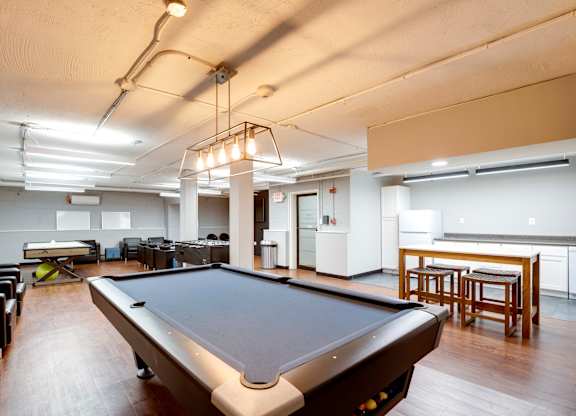 Game room with a pool table at Mason Hall in Alexandria, VA 22314