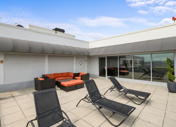 Rooftop deck with lounge chairs at Lenox Club, National Landing, Arlington, VA, 22202