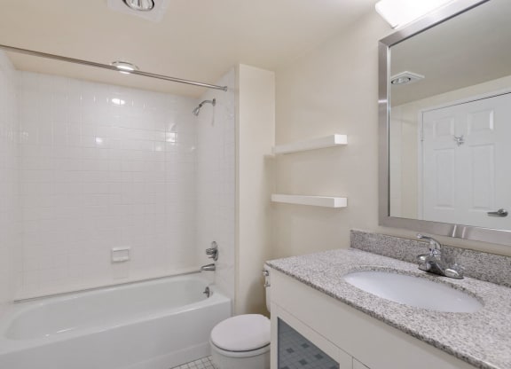 Renovated bathroom with granite countertops  at Lenox Club Apartments, National Landing Arlington, VA 22202