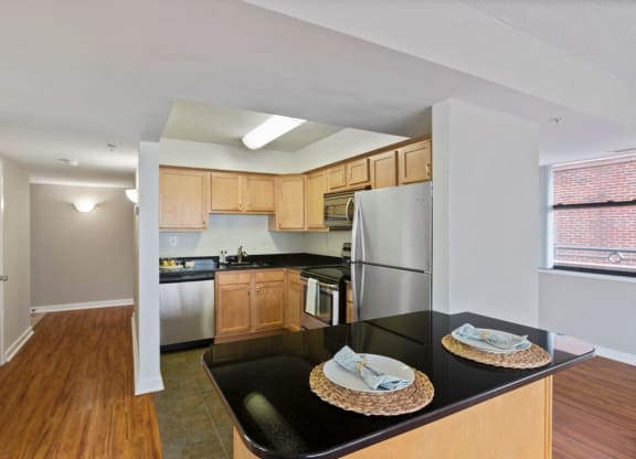 kitchen with stainless steel appliances and bar area at 1633 Q, Washington, 20009
