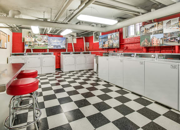 Laundry room with seating area at Highview and Castle Manor, Washington, DC