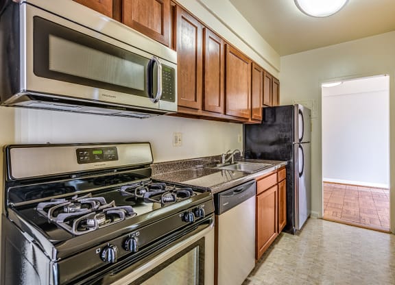Renovated kitchen with stainless steel appliances at Idaho Terrace, Washington, 20016