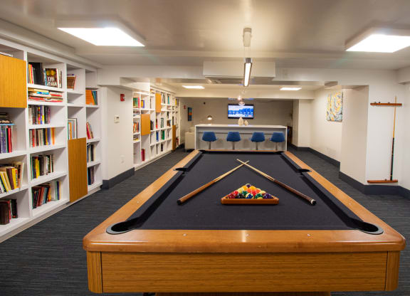 a room with a pool table and a television at The Argonne Apartments, Washington, 20009