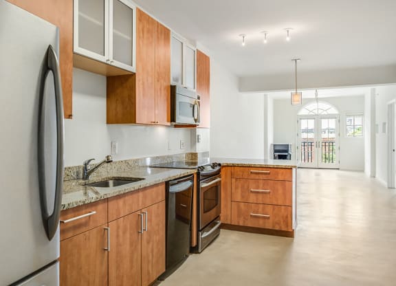 Renovated kitchen with granite at Kalorama Park, Washington, DC 20009countertops and stainless steel appliances