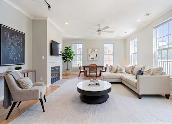 A living area with fireplace at The Residences at King Farm