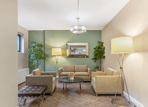 a living room with couches and chairs and a table
