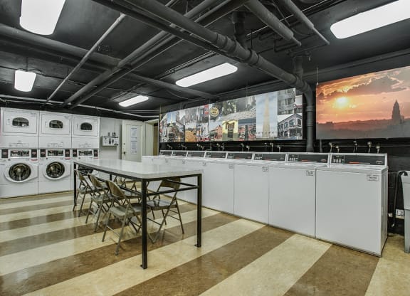 Laundry room with seating area at Mason Hall in Alexandria, VA 22314