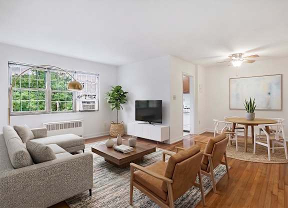 Living room, dining area and kitchen (virtually staged) at Mason Hall in Alexandria, VA 22314