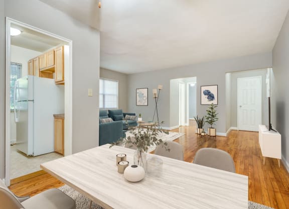 Apartment living and dining area (virtually staged) at Mason Hall in Alexandria, VA 22314
