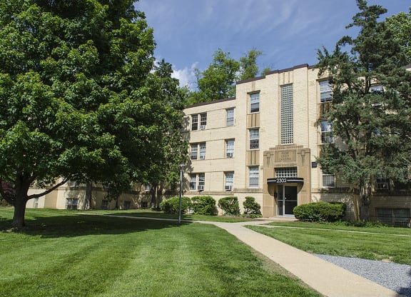 Building exterior with trees at Park Crest Apartments, District of Columbia
