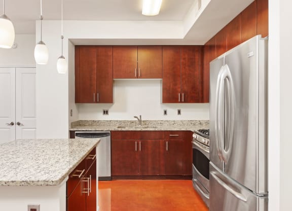 Kitchen with granite countertop and stainless steel appliances at Park Place at Petworth, Washington, DC 20011