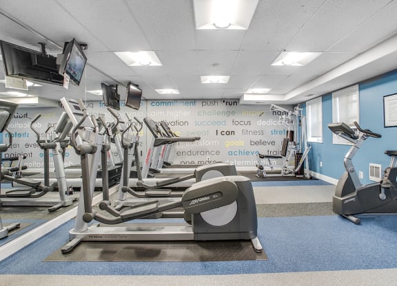 Fitness center with treadmills, machines and free weights at President Madison, Washington, Washington