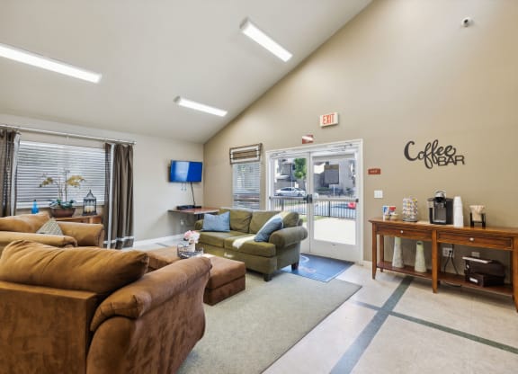 a living room with couches and chairs and a coffee table