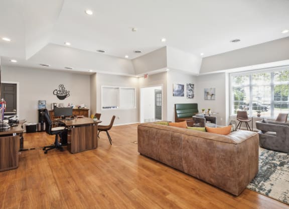 a living room with a couch and a desk