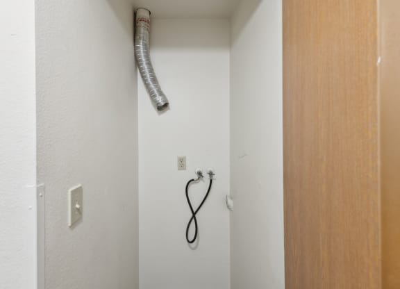 a blow dryer is hanging on the wall in a bathroom