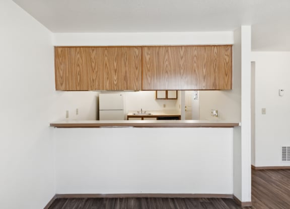 a kitchen with a white wall and a counter top
