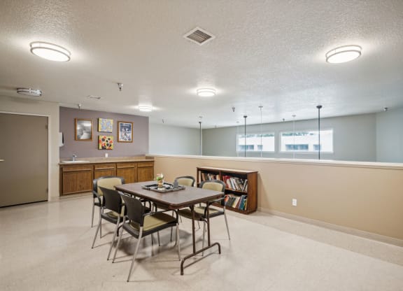a dining room with a table and chairs